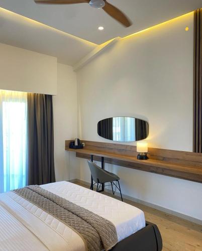 Ένα ή περισσότερα κρεβάτια σε δωμάτιο στο Hotel Comfort & Villas