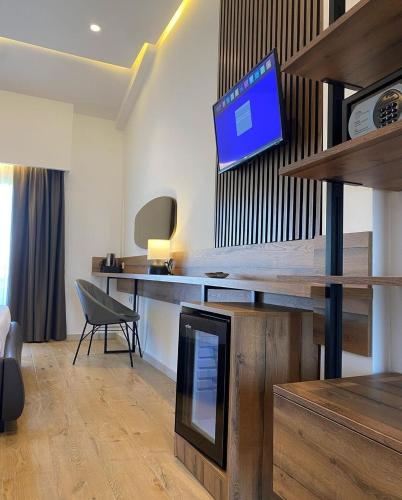 Μια τηλεόραση ή/και κέντρο ψυχαγωγίας στο Hotel Comfort & Villas