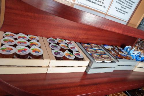 a display of cupcakes and other pastries on a table at Hotel Villa Strassoldo "Ex Attianese Hotel Restaurant" in Cervignano del Friuli