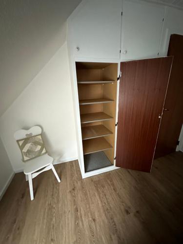 a room with a closet and a book shelf at Skovbrynet 2 The place for you in Løkken