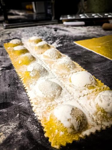 a pizza with powdered sugar on top of it at Auberge du château de Joux in La Cluse et Mijoux