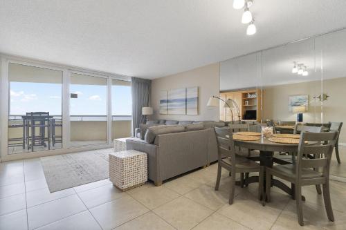 a living room with a couch and a table at Perdido Sun 304 in Perdido Key