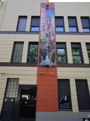 a tall building with a sign on the side of it at FamilyHostelPinto in Pinto