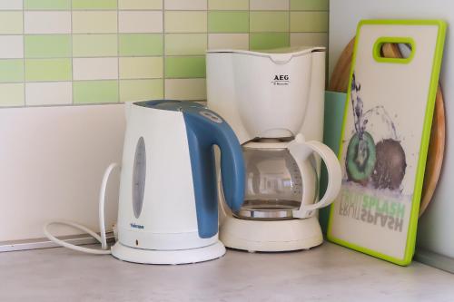 two kettles on a counter in a kitchen at Apartments Panda in Bol