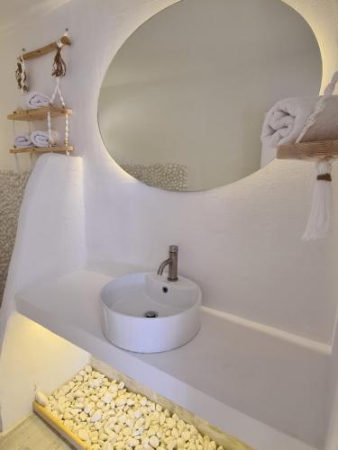 a white bathroom with a sink and a mirror at Meteora Superior Collection Villas II in Kalabaka