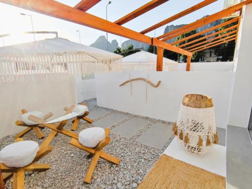 a room with two chairs and a table at Meteora Superior Collection Villas II in Kalabaka