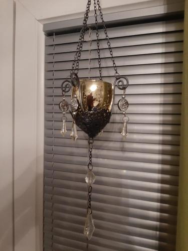 a chandelier is hanging in front of a window at Medina in Sarajevo