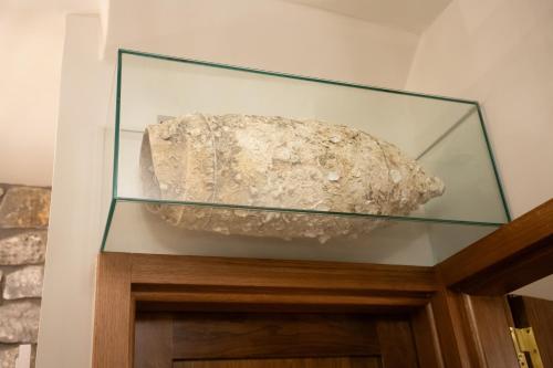 a rock in a glass tank on top of a cabinet at Armenopetra View Gerolimenas in Gerolimenas