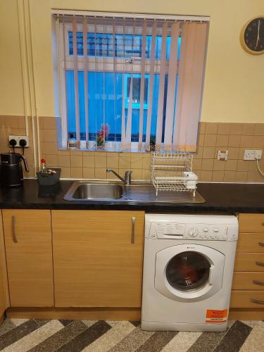 Kuchyň nebo kuchyňský kout v ubytování Peacehaven Homestay Deluxe Room
