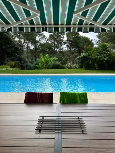 Der Swimmingpool an oder in der Nähe von Entre Océan et Golf Séjour de Rêve Luxe