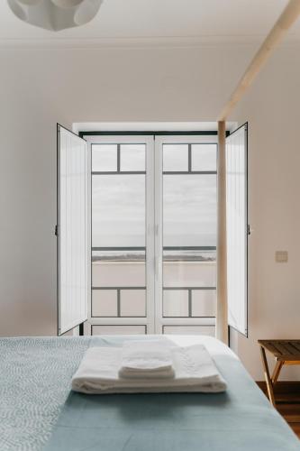 Postel nebo postele na pokoji v ubytování Casa do Xixo