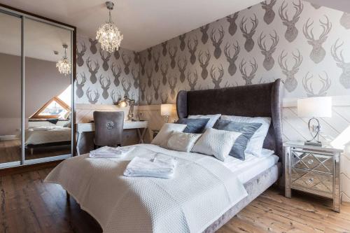 Postel nebo postele na pokoji v ubytování Aparthotel Góralski Spa & Restaurant