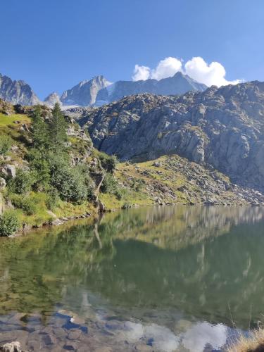 a mountain view of a lake in the mountains at NEW ENTRY - Nuova villa nel verde in Mezzana