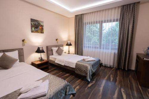 Postel nebo postele na pokoji v ubytování Hotel RAS Pazarište