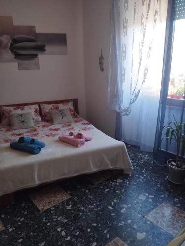Кровать или кровати в номере La Maddalena b&b da Marco