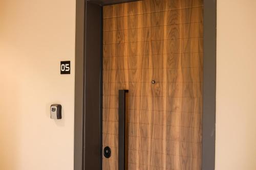 a wooden door with the number on it at Blue Studios in Golem