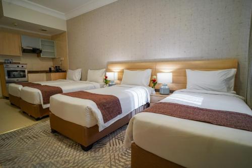 Letto o letti in una camera di Emaar Al Noor