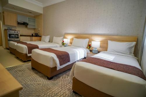 Letto o letti in una camera di Emaar Al Noor
