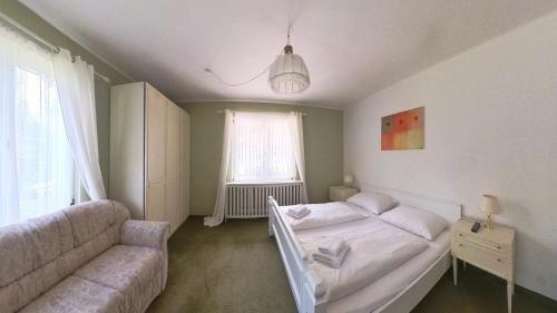 Postel nebo postele na pokoji v ubytování Das Christine Appartement