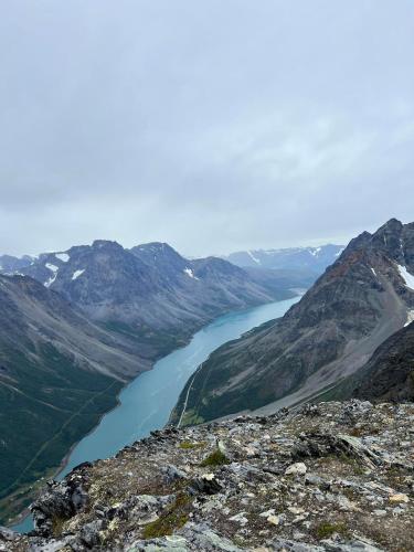 a view of a river in a mountain range at Lyngen Apartments in Lyngseidet