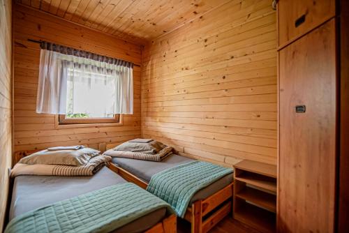 Postel nebo postele na pokoji v ubytování Domki Bena Dziwnówek