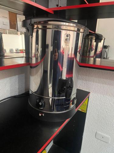a blender sitting on top of a kitchen counter at Hotel Orozco in Antofagasta