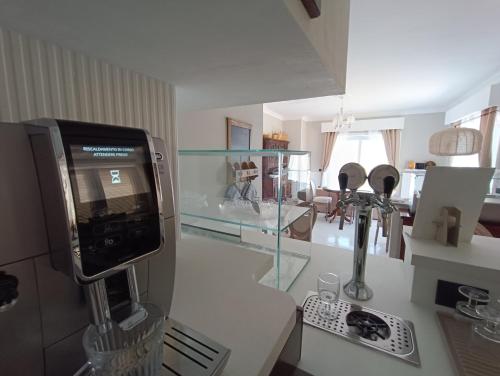 a kitchen with a counter with a glass display at Relais Tiaré Bed and Breakfast in Bacoli