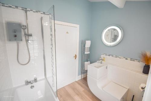 a bathroom with a shower and a toilet and a sink at Central Stays - Luxury Central Townhouse - With Free Parking in Chester