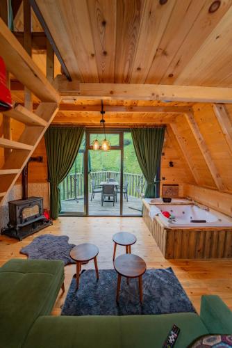 a living room with a pool table in a cabin at Kervan Konaklama in Ardeşen