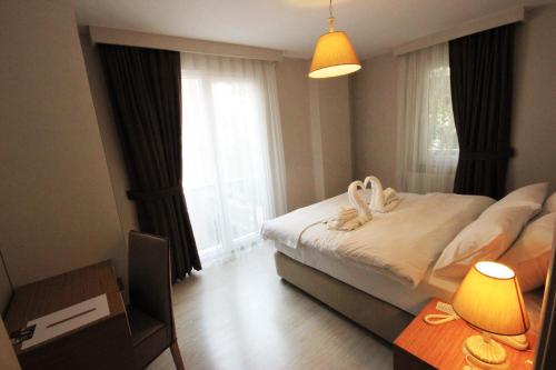 Katil atau katil-katil dalam bilik di Şeker Apartments