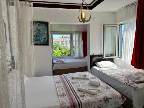 Postel nebo postele na pokoji v ubytování Bonjourla Otel