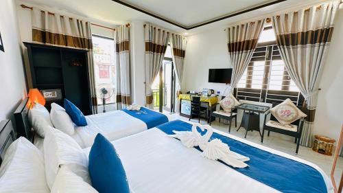 Ένα ή περισσότερα κρεβάτια σε δωμάτιο στο Serenity Villa Hoi An