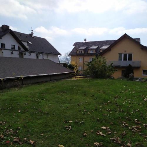 a yard in front of a house at Penzion U Jandů in Běhařov