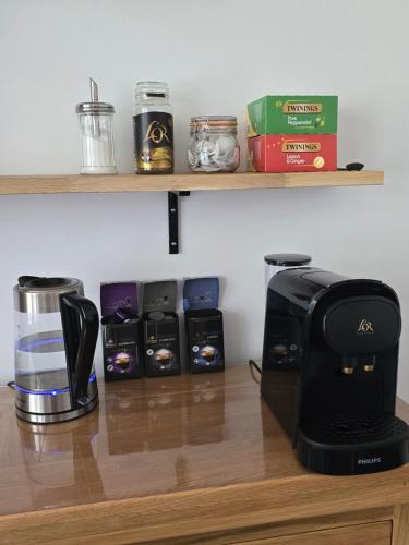 a kitchen counter with a coffee maker and a toaster at Victorian Renovation Room 7 in Liverpool