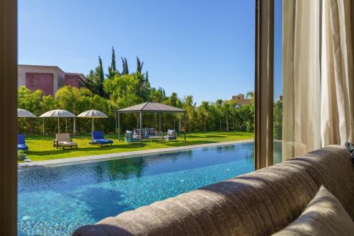 Kolam renang di atau dekat dengan Villa Naciri en plein golf avec vue sur Atlas