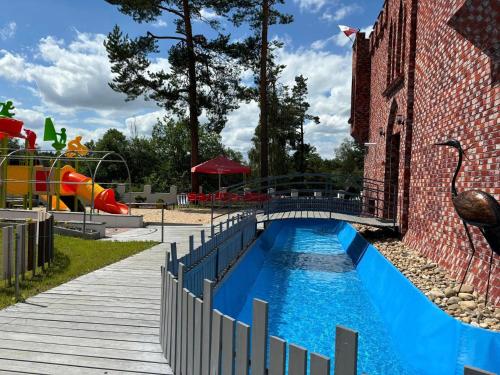 a water park with a water slide at Witómë Kaszubskie Siedlisko in Załakowo