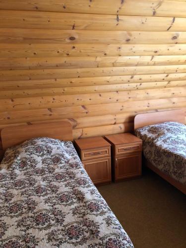 Postel nebo postele na pokoji v ubytování Коттедж