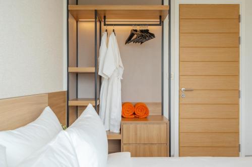 a bedroom with a bed and a closet at Laguna Lakeside apartments with panoramic view in Bang Tao Beach