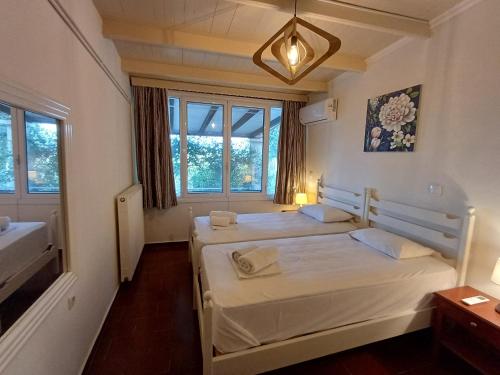 Postel nebo postele na pokoji v ubytování Penelope Apartment Hotel