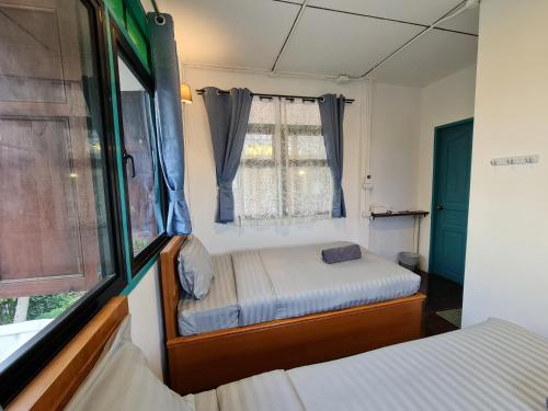 Ein Bett oder Betten in einem Zimmer der Unterkunft TepbunthomHouse Ayutthaya
