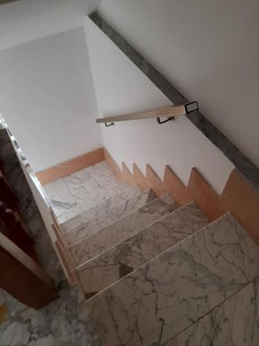 an overhead view of a staircase with marble floors at Meridiana in Santa Maria del Molise