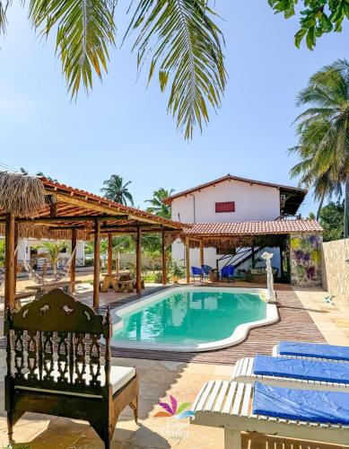 a view of a swimming pool in a resort at Pousada Curva dos Ventos in Icaraí