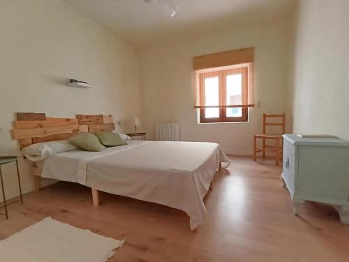 Postel nebo postele na pokoji v ubytování La Casa del Chellero