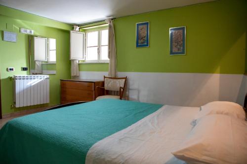 A bed or beds in a room at Casa Vacanze Diamante