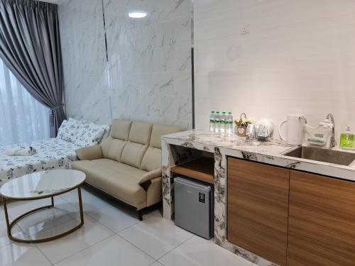 a living room with a couch and a table at Sky Trees Apartment at Bukit Indah Johor in Johor Bahru