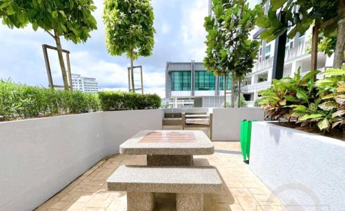 a pair of benches sitting on top of a balcony at Sky Trees Apartment at Bukit Indah Johor in Johor Bahru
