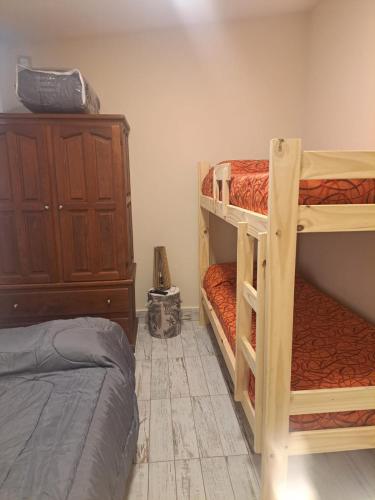 a bedroom with two bunk beds and a bed at Palma de Mallorca 173 in Santa Clara del Mar