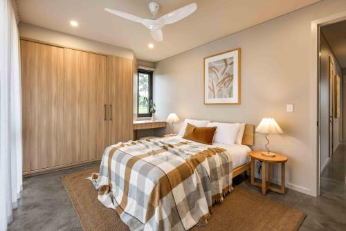 a bedroom with a large bed and a window at Birdnest Galah in Witchcliffe