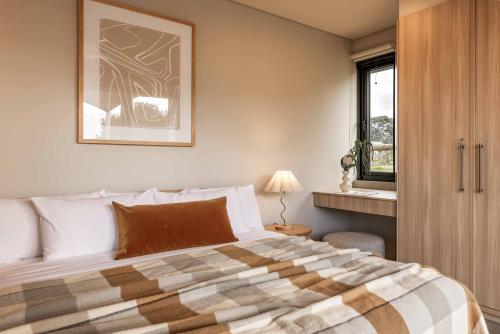 a bedroom with a bed and a window at Birdnest Galah in Witchcliffe