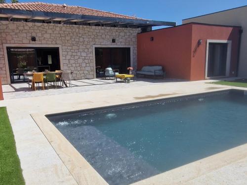 a swimming pool in front of a house at Casa Julia in Vila Nova de Cerveira